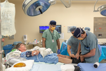 Tim Heenan is prepared for surgery with Dr. Amir Khoshbin