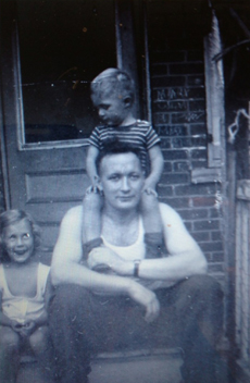 John Allen sits on the shoulders of his father, Sam John Allen sits on the shoulders of his father, Sam