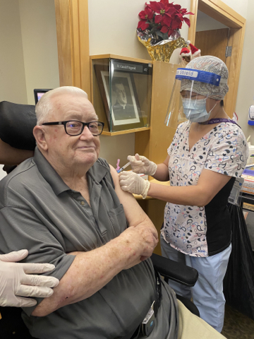 Father Gerald Fitzgerald receives the vaccine.(Photo: Houses of Providence Activation Team)