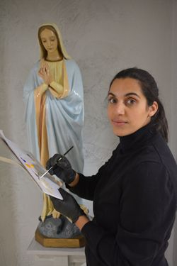 Conservator Alicia Coutts-Farrugia restored a statue of Mother Mary that has graced Providence's hall for more than 60 years. (photos by James Wysotski)