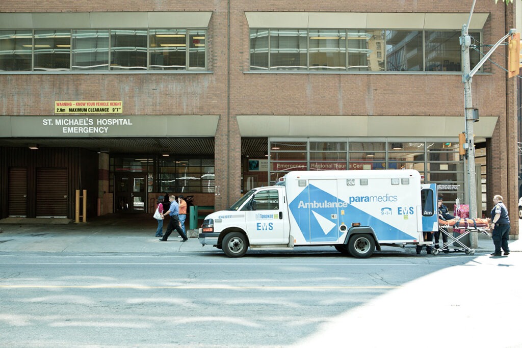 View of entrance to the St. Michael's Emergency Department with an ambulance parked out front.