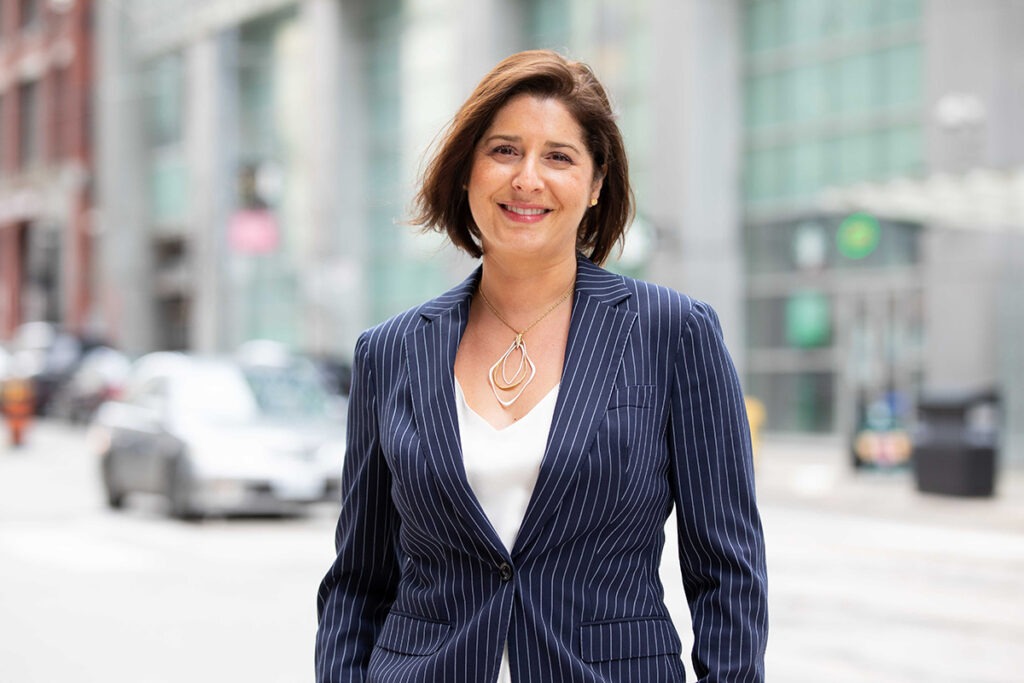 Dr. Yvonne Bombard stands outside the Li Ka Shing Knowledge Institute.