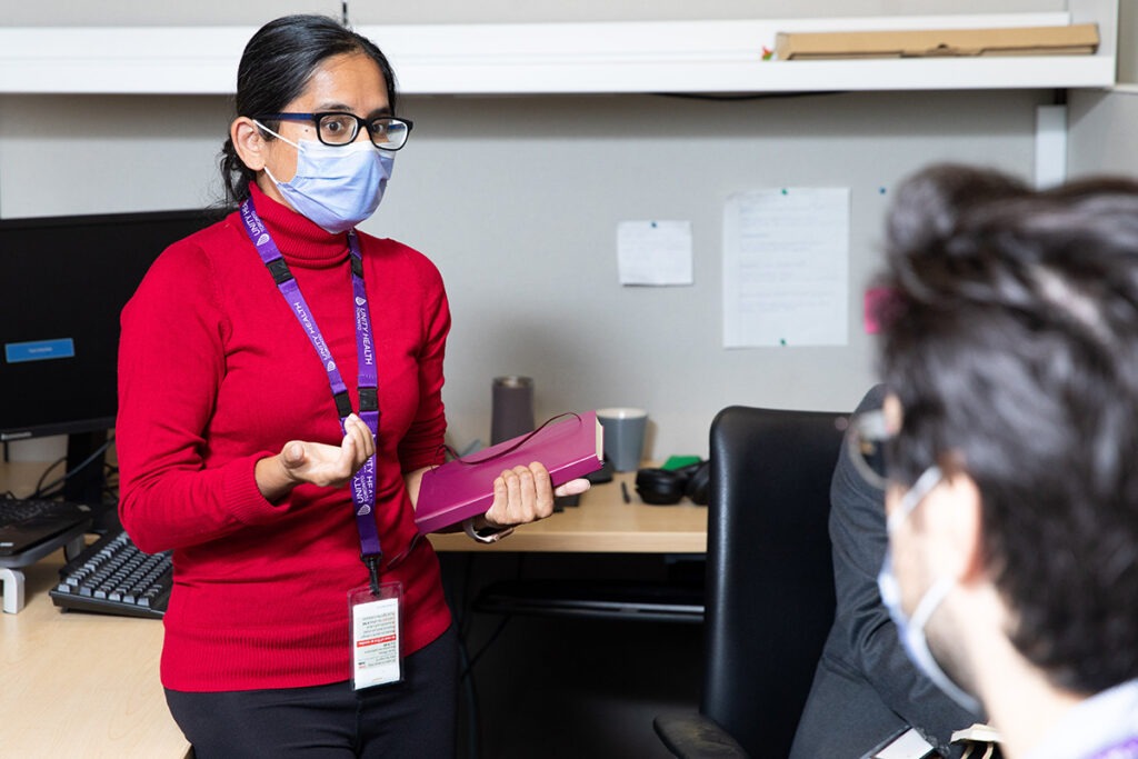 Dr. Sharmistha Mishra leads a team meeting.