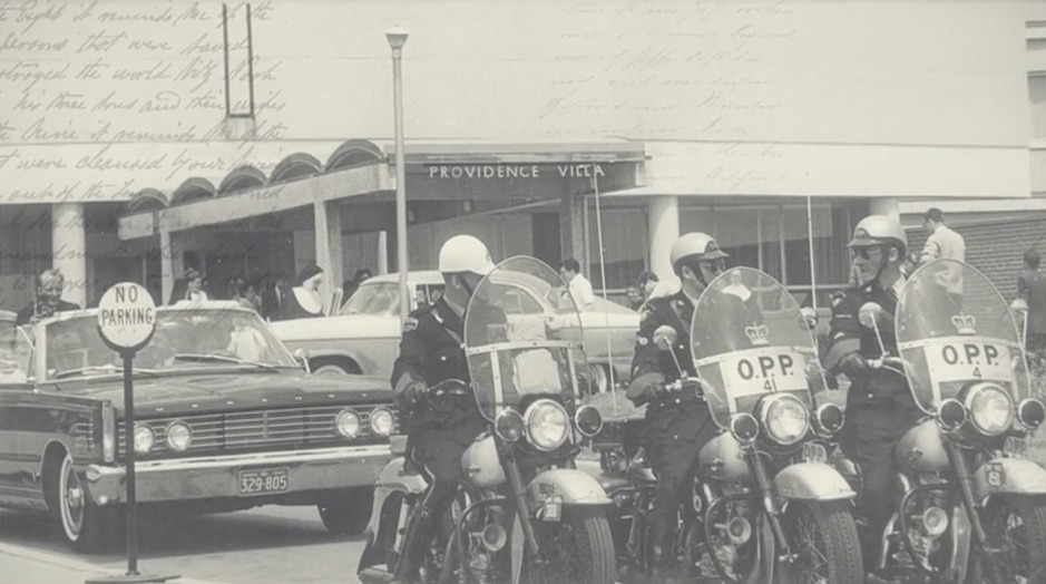 A police motorcade leads residents to the new Providence Villa location in 1962.