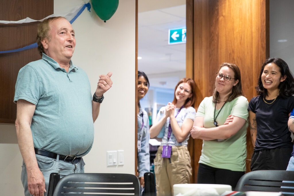 Gord Singer speaks to a room full of colleagues during his retirement party.